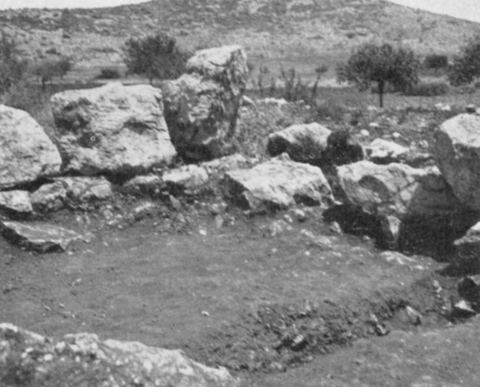Fig. 22 'Blockhouse Near Lerna, N.E. Corner, Showing Entrance': excavated wall corner of the late-antique blockhouse c. 3 km beyond the spring of Lerna, with bare hills and olive trees behind.