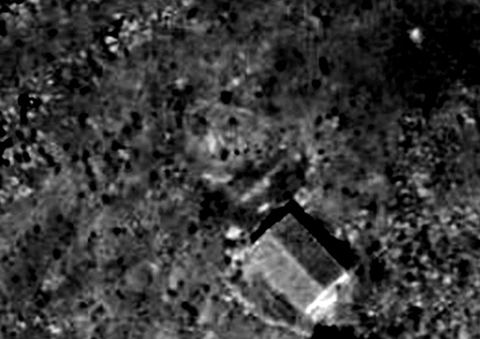 Crop of a 1941 vertical aerial photo showing the small gabled Profitis Ilias chapel next to the castle on Pontinos.