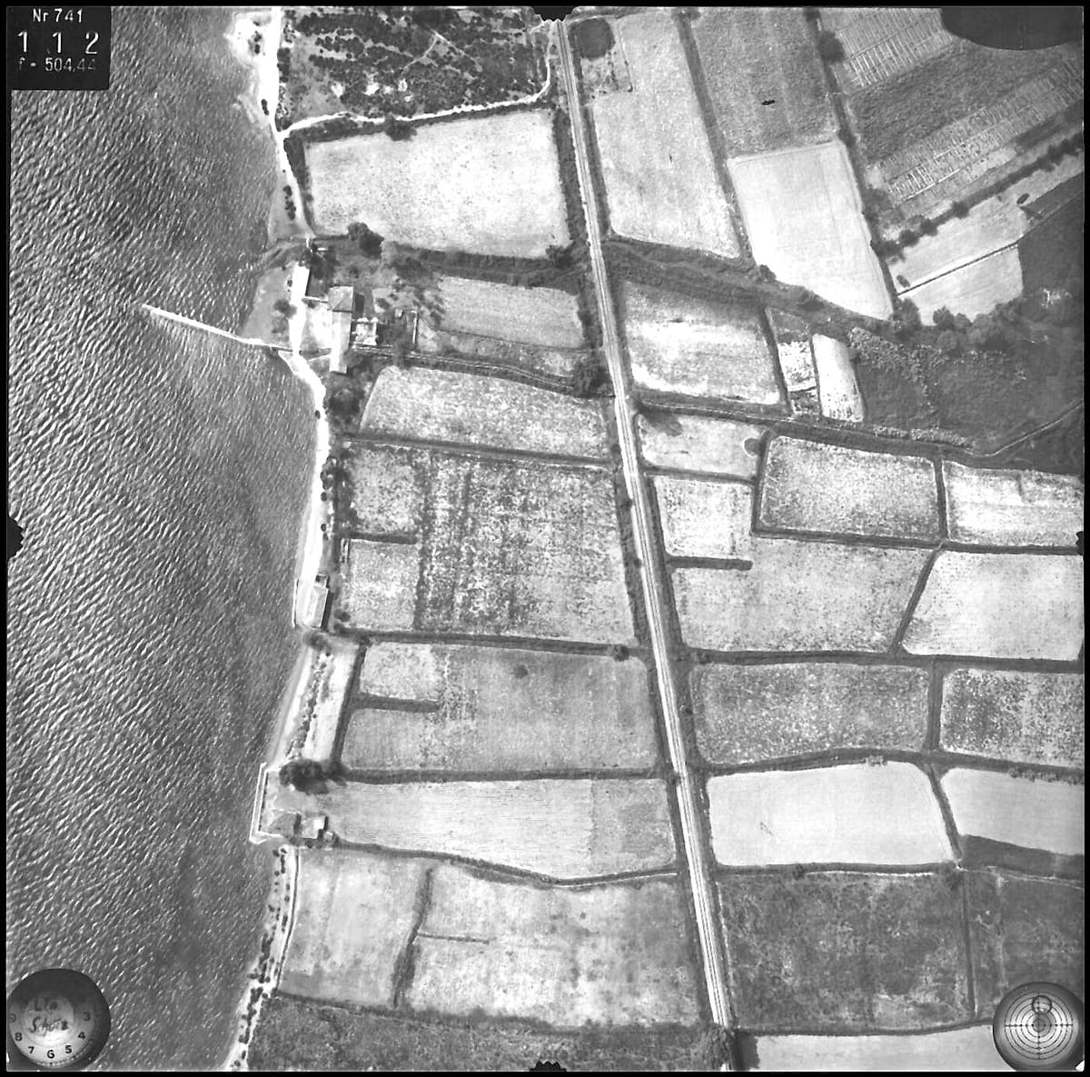 Aerial view of the long pier at Myloi in July 1941, with fields down to the coast