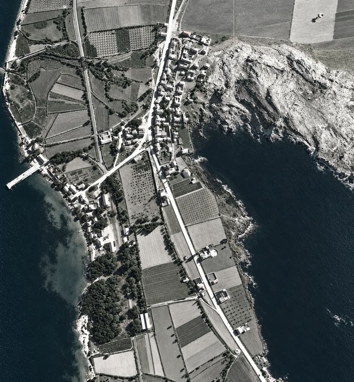 Myloi from the air, 1941–1942: the village along the main road, the pier, the station, fields and orchards, and the rocky slope of Pontinos by the sea (digitally restored)