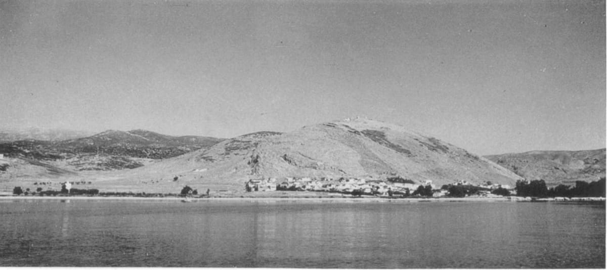 Myloi seen from the sea in 1957: a low line of white houses below Pontinos hill
