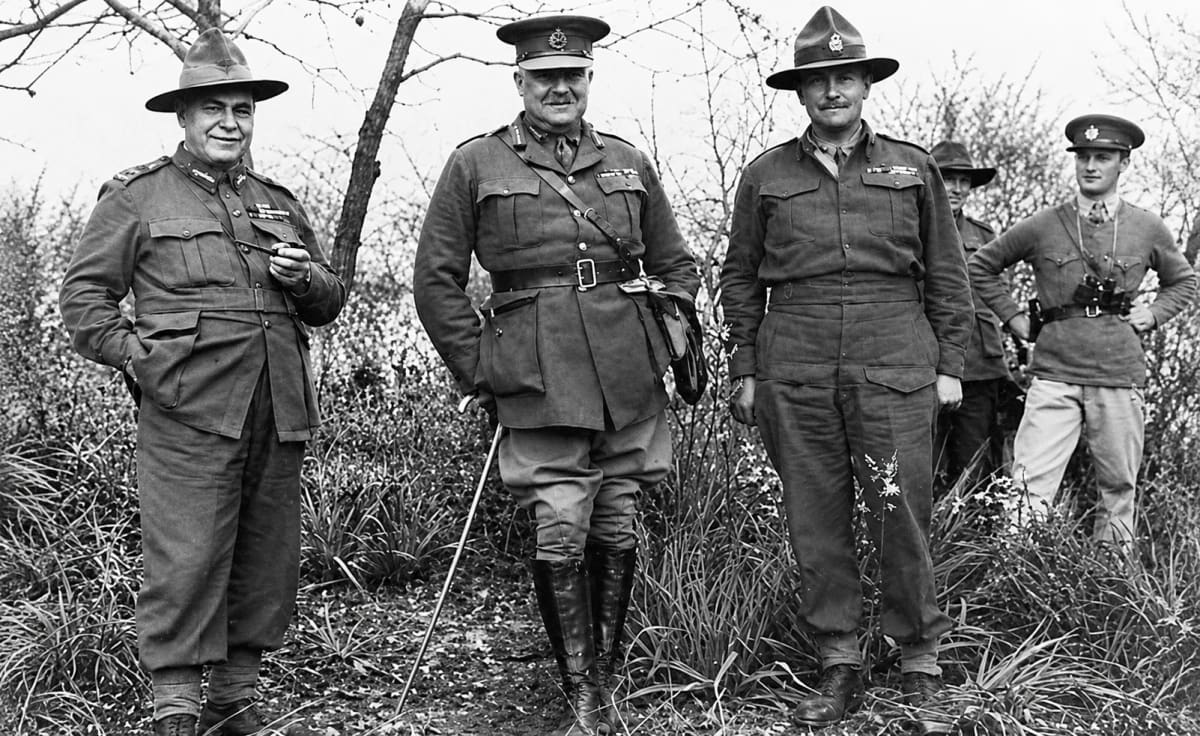 Greece, 1941: Lieutenant General Thomas Blamey with a pipe, Lieutenant General Henry Maitland Wilson and Major General Bernard Freyberg in the field, with two officers behind them
